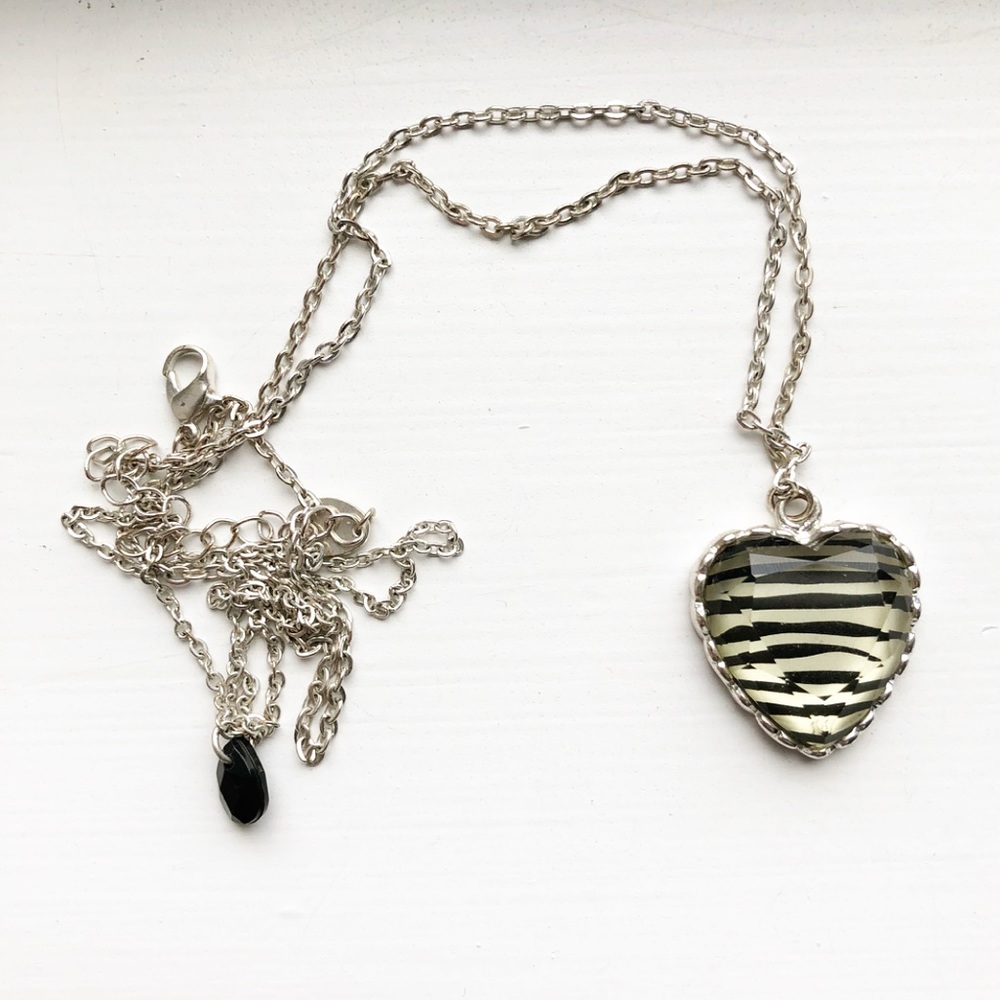 Silver Claire’s zebra print heart necklace